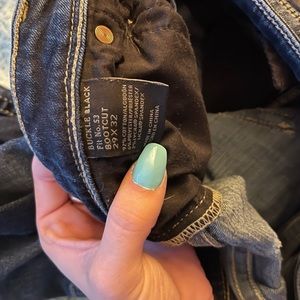 Buckle black bootcut jeans